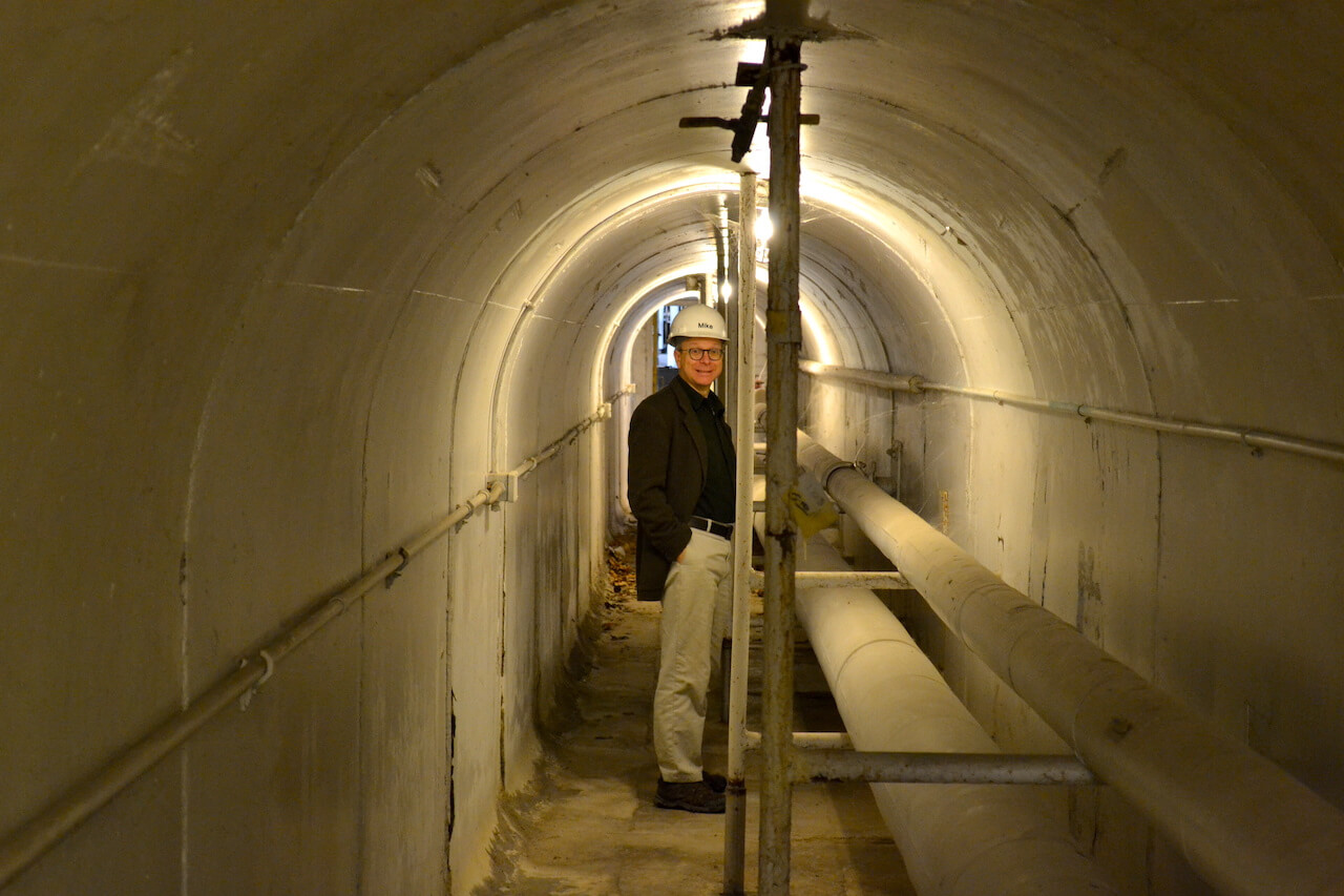 Man with hard hat in underground tunnel